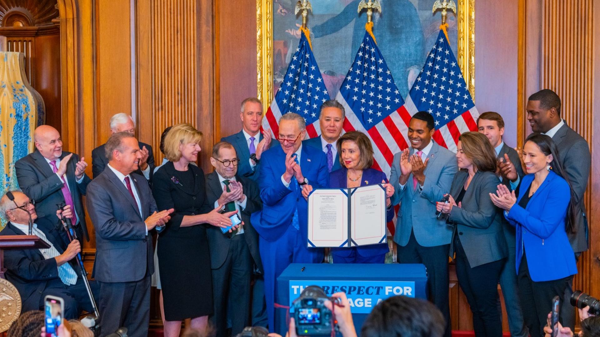 Photo of Members of Congress at the Enrollment Ceremony for the Respect for Marriage Act